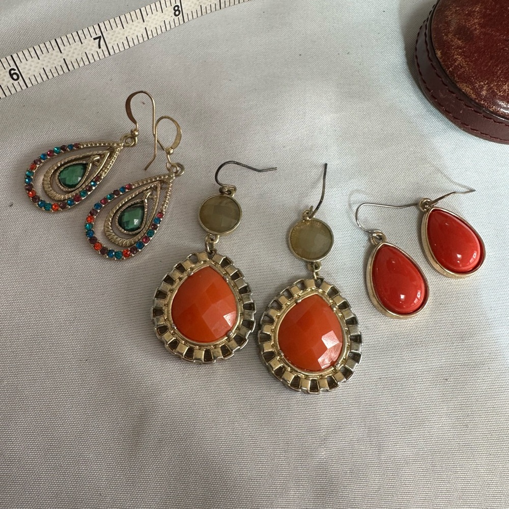 Three pair orange and rhinestone vibe earrings